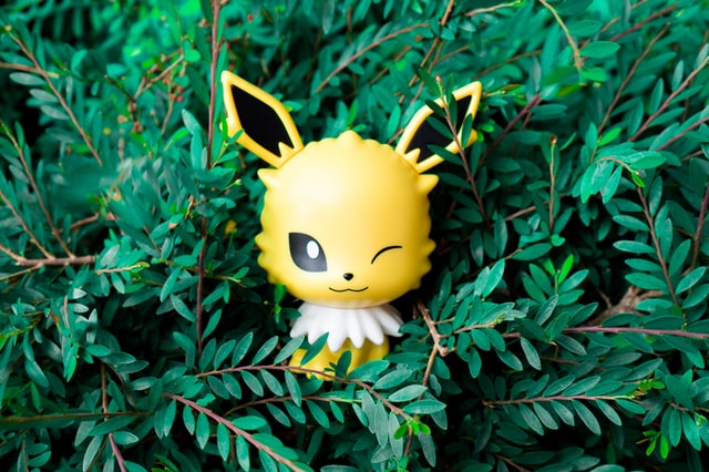 Image showing a Pokemon-type character in foliage.